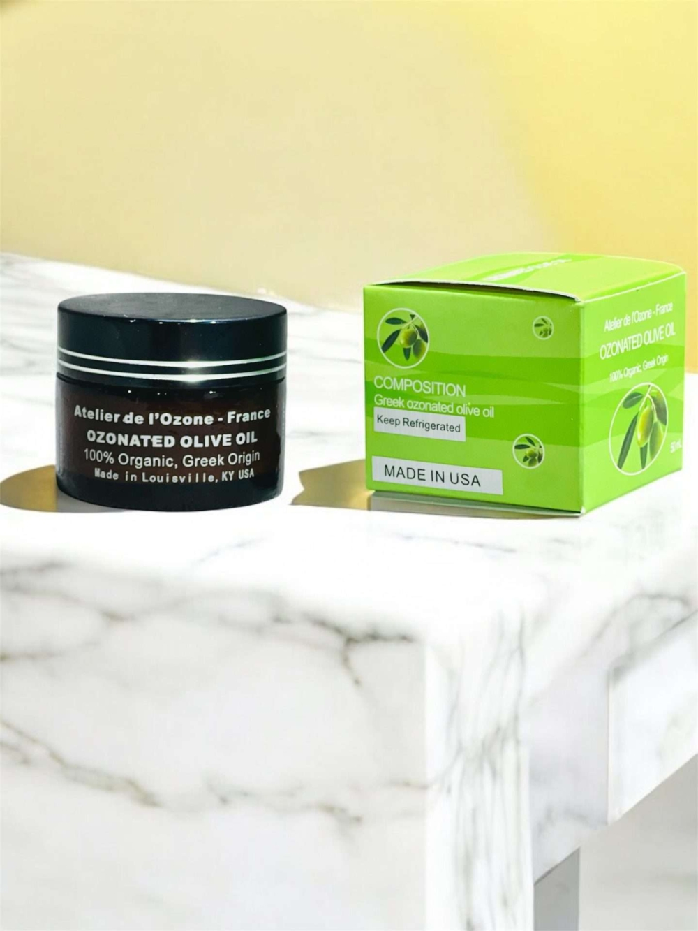 ozonated olive oil jar and box on marble